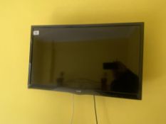 An LG TV measuring 16 inches high by 26 inches wide