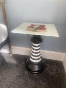 A Hatter's bedside table featuring the White Rabbit