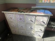 An adult Alice-in-Wonderland themed sideboard