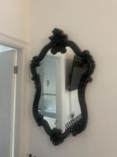 A black framed mirror