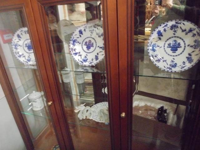 Two shelves of assorted ceramics.