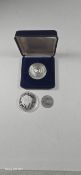 Three commemorative silver coins; Swiss 1972 Iccarus medallion in its box; 2020 Battle of Britain