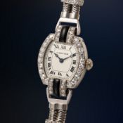 A FINE & RARE LADY'S PLATINUM, 18K SOLID GOLD, DIAMOND, ONYX & BLACK ENAMEL CARTIER COCKTAIL WATCH