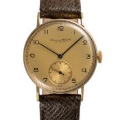 A GENTLEMAN'S SIZE 14K SOLID GOLD IWC WRIST WATCH CIRCA 1950, GOLD DIAL WITH ART DECO NUMERALS