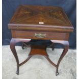 Inlaid mahogany envelope card table, the top having swivel action opening to reveal green baize