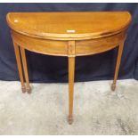 Mahogany cross banded and string inlaid demi lune card table, the top folding over to reveal green