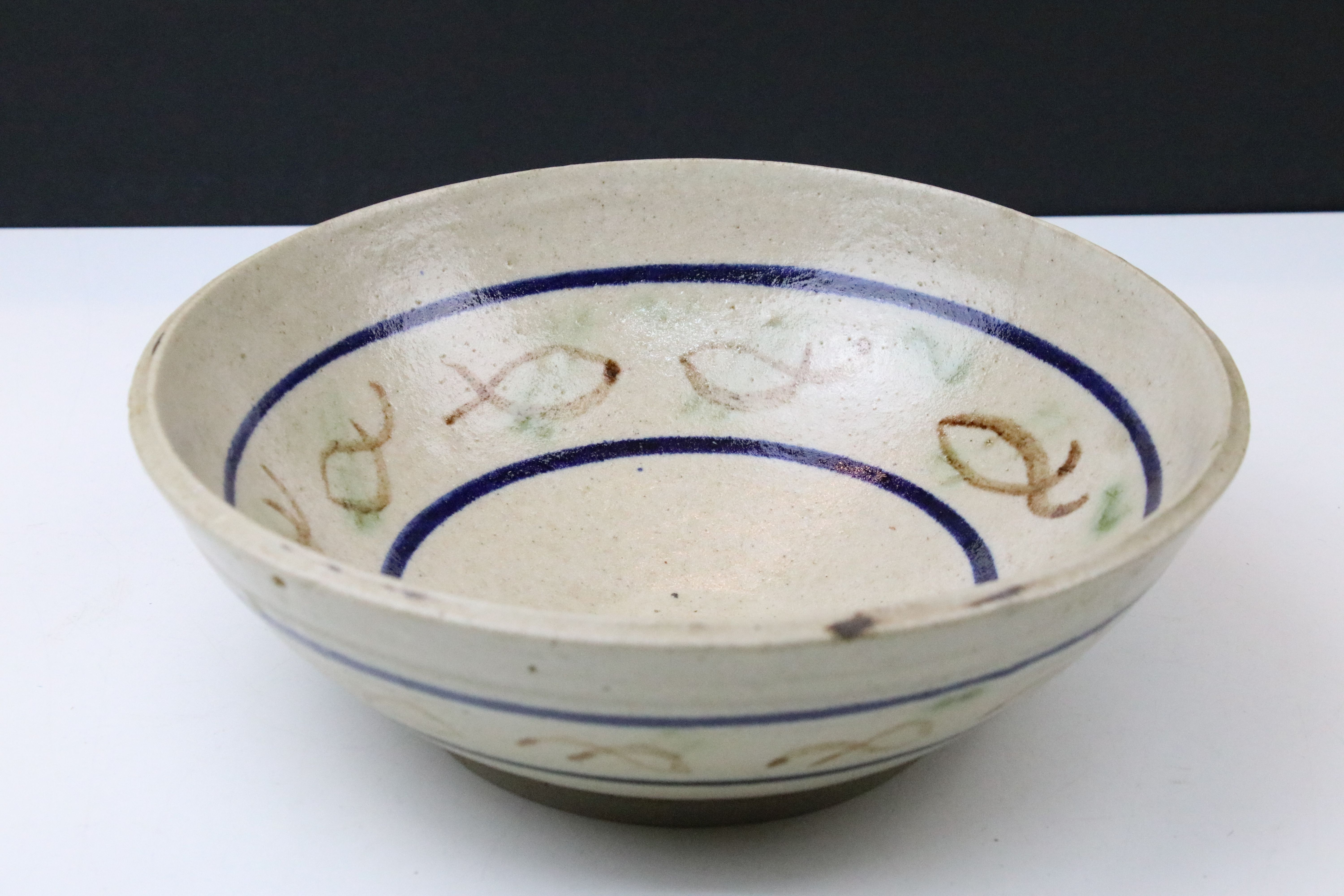 Cardew green glazed bowl, 21cm diameter and a signed studio pottery bowl with fish pattern, 25cm - Image 2 of 7