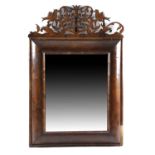 A WILLIAM AND MARY WALNUT WALL MIRROR LATE 17TH CENTURY the later rectangular plate in a cushion