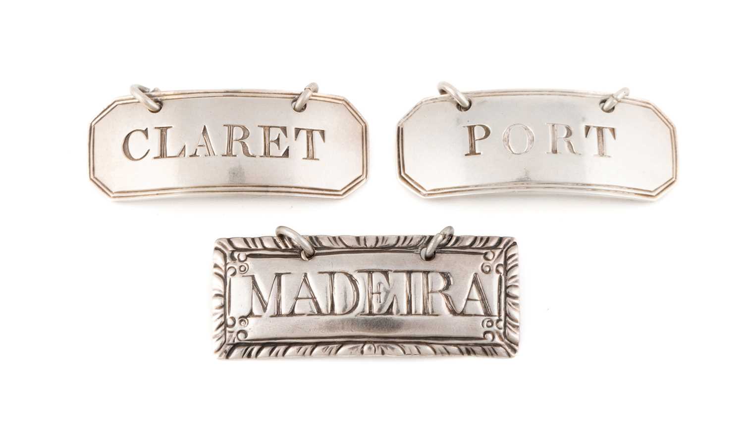 A pair of George III silver wine labels, by Hester Bateman, London circa 1786, rectangular form with