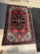 PERSIAN-STYLE AREA RUG (83” × 53”)
