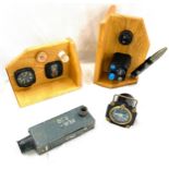 Selection of war / plane parts to include wooden bookends featuring aircraft gauges and parts, WW2