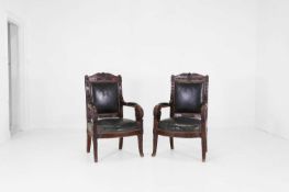 A near pair of Empire stained beech fauteuils,