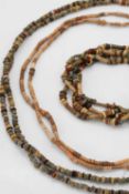 A collection of Egyptian beaded necklaces,