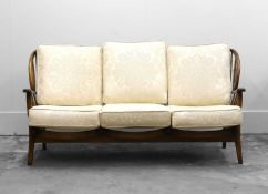 An Ercol style stained beech settee,