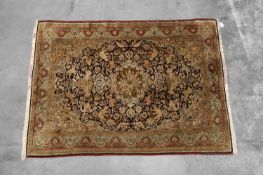 A Persian silk and wool Qum rug,