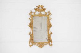 A George III-style carved giltwood pier mirror,