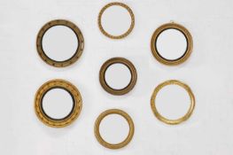 A group of eight various giltwood convex mirrors,