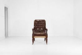 A George IV mahogany and leather library armchair,