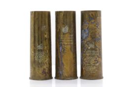 Three brass commemorative artillery shell casings,