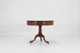 A small George III mahogany drum library table,