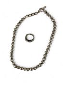 A vintage silver bead necklace together with a white metal crossover serpent ring