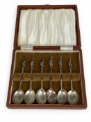 A cased set of six early 20th century silver coffee spoons with seated cat finials, Barker Brothers