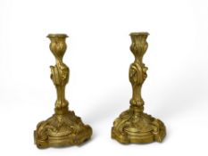 A pair late 19th century French Louis XV style gilt bronze ormolu candlesticks