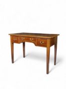 A George III mahogany and boxwood strung dressing table