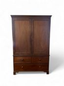 A Regency mahogany linen press in the manner of Gillows