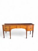 A large late George III mahogany bowfront sideboard