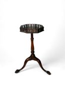 A George III carved mahogany urn table or kettle stand