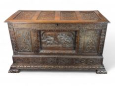 A large 17th century style carved oak chest