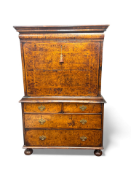 A William and Mary stained burr ash, walnut, crossbanded and featherbanded escritoire