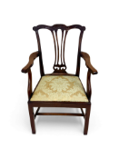 A George III carved mahogany open armchair