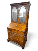 A Queen Anne walnut crossbanded and featherbanded bureau cabinet