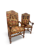 A pair of 19th century Louis XIV style carved walnut open armchairs