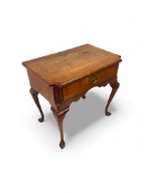 A George II walnut, crossbanded and featherbanded lowboy