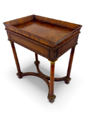 A Regency Empire style mahogany and gilt brass mounted work table