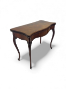A George III carved mahogany serpentine card table