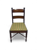 A set of eight Regency mahogany and satinwood dining chairs including a pair of open armchairs