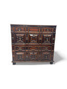 A late 17th century oak and fruitwood geometric moulded chest