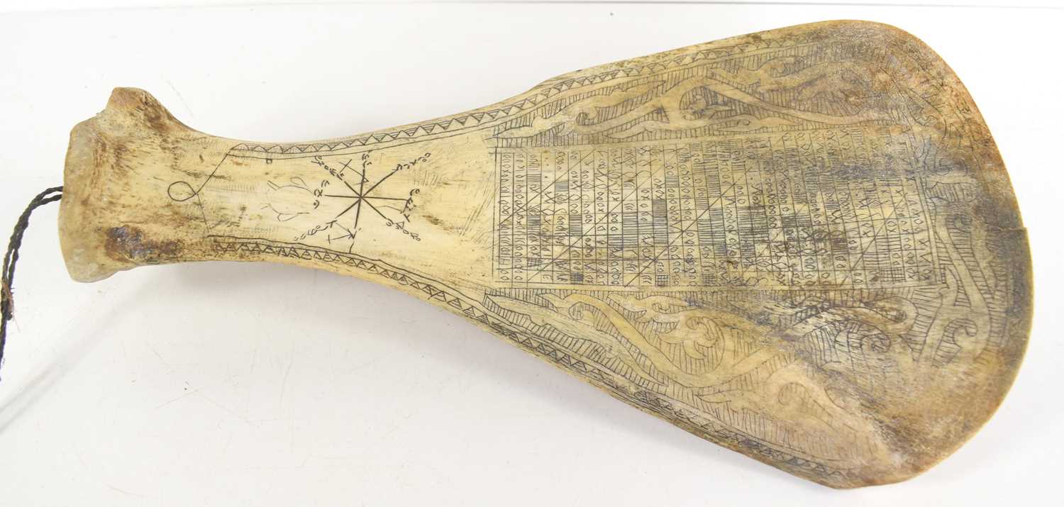 An Indonesian Batak scrimshaw shoulder blade, possibly water buffalo, 30.5cm.