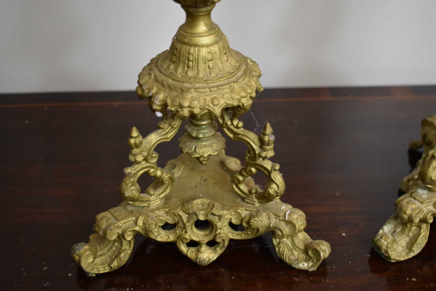 A pair of 19th century gilt metal and porcelain table candelabra, the ...