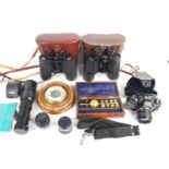 A group of collectables to include an Optomax camera zoom lens, an Olympus OM40 Program 35mm camera,