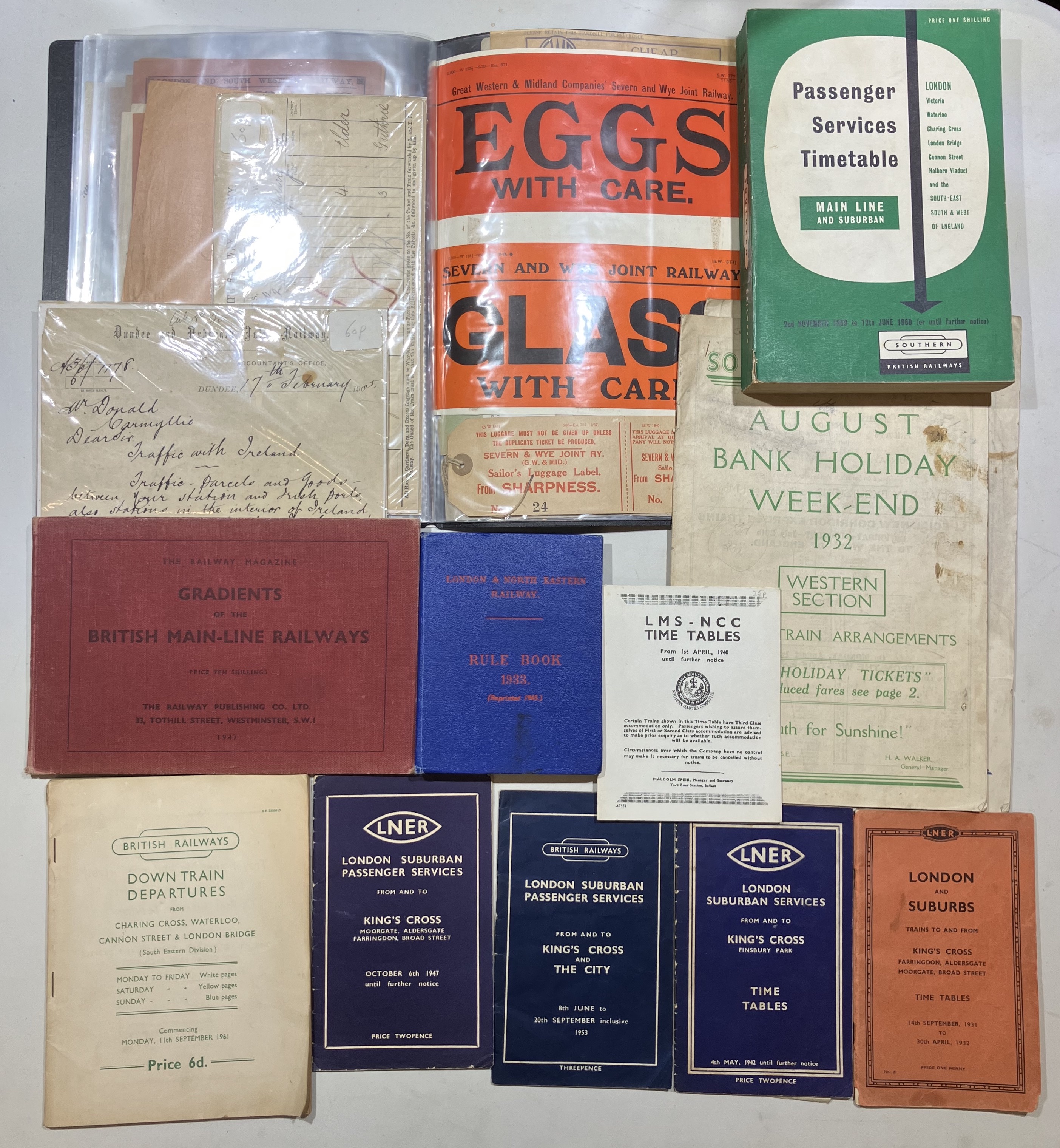 A mixed quantity of railway booklets and timetables and two folders of pre-grouping paperwork.