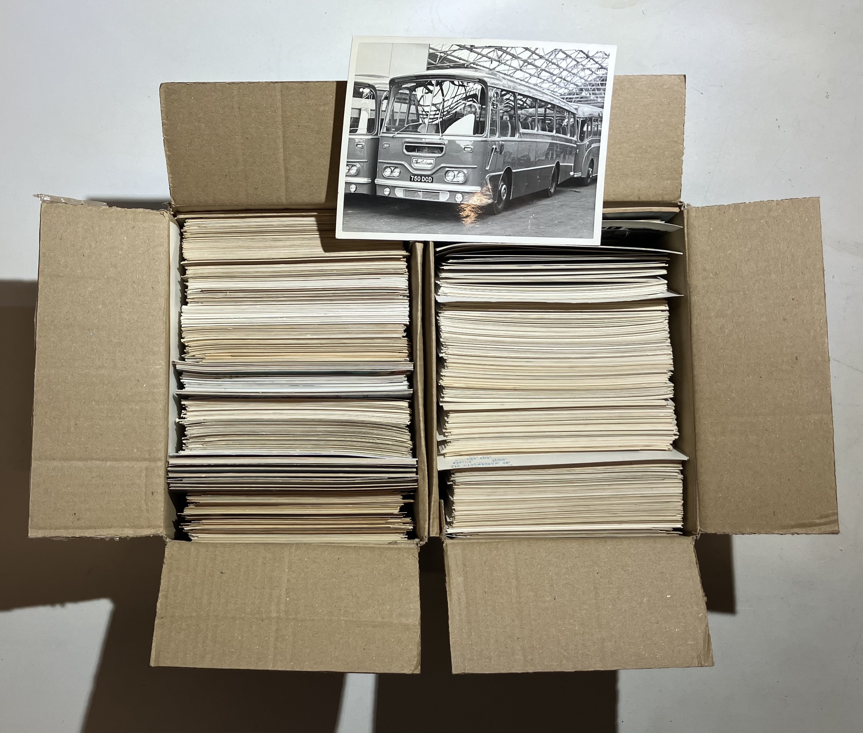 Estimated 1200 photographs that are a mix of postcard size black and white and 6x4 colour photos.