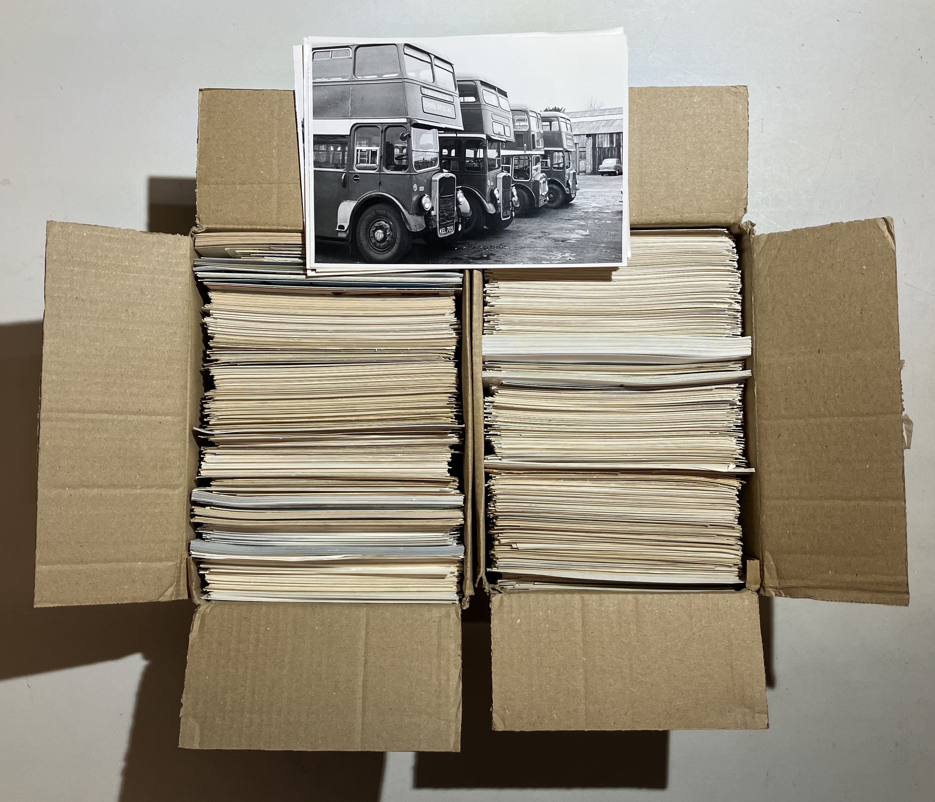 Estimated 1200 photographs that are a mix of postcard size black and white and 6x4 colour photos.