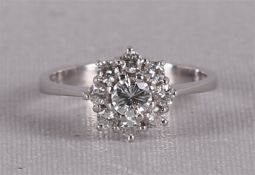 Een 18 krt gouden entouragering met een briljant van 0.25 crt en entourage.