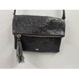 Anya Hindmarch huxley braided leather long strap shoulder bag with tassel , showing minimal signs of