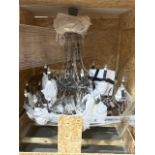 A large classic style crystal drop chandelier,with black glass details previously used at the cafe